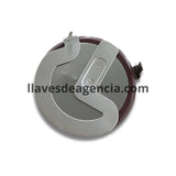 Detalle de batería recargable LIR2020 mostrando terminales soldables en escuadra 90 grados con aislamiento café para llave Land Rover BMW